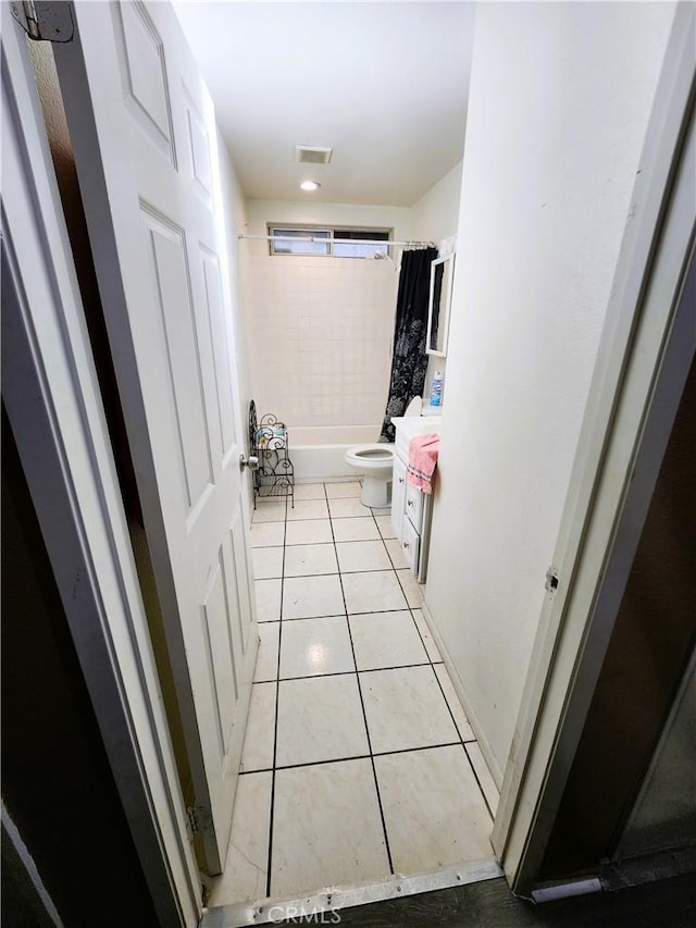 1210 W Manchester Ave, Los Angeles, CA 90044 - full bathroom featuring vanity, shower / tub combo with curtain, tile patterned floors, and toilet