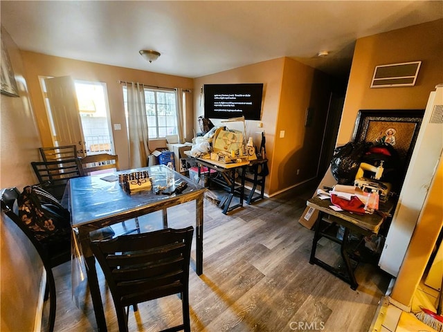 1210 W Manchester Ave, Los Angeles, CA 90044 - dining space with wood finished floors and baseboards
