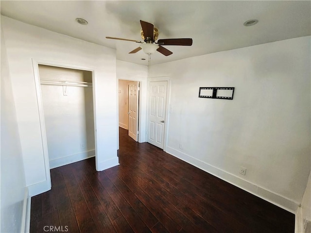 1210 W Manchester Ave, Los Angeles, CA 90044 - unfurnished bedroom featuring hardwood / wood-style floors, baseboards, a closet, and ceiling fan