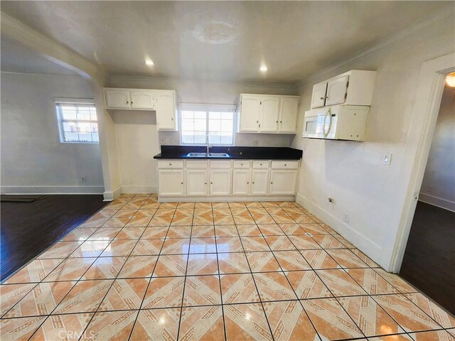 1210 W Manchester Ave, Los Angeles, CA 90044 - kitchen with a sink, plenty of natural light, baseboards, ornamental molding, and recessed lighting