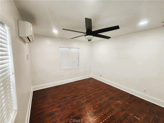 1210 W Manchester Ave, Los Angeles, CA 90044 - spare room with wood-type flooring, a ceiling fan, baseboards, recessed lighting, and a wall mounted air conditioner