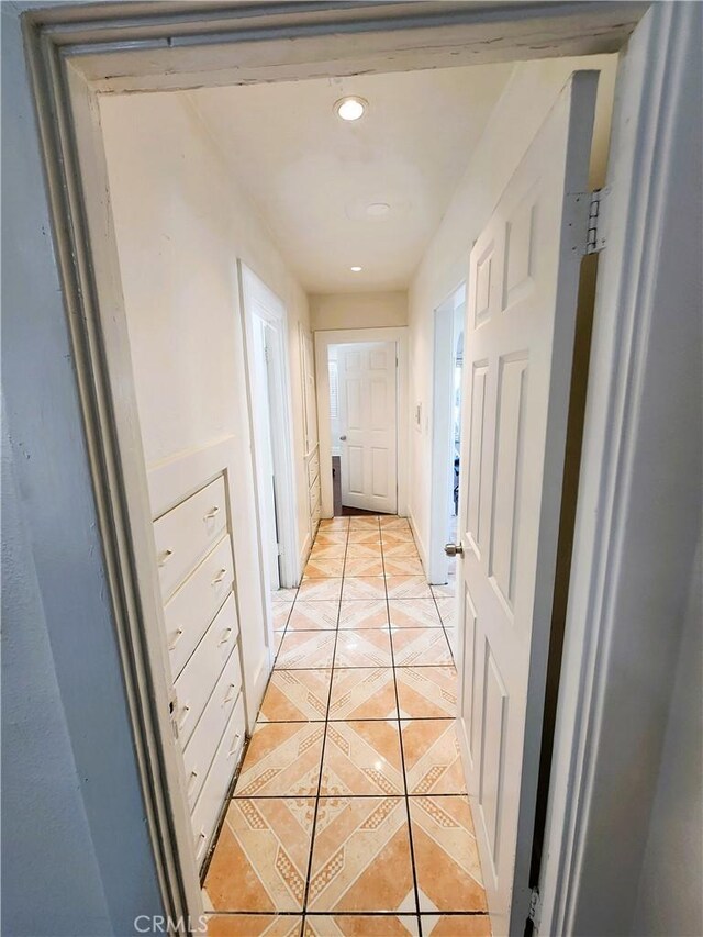 1210 W Manchester Ave, Los Angeles, CA 90044 - hallway with light tile patterned floors and recessed lighting