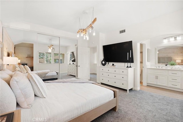 9 Via Olorosa, Rancho Santa Margarita, CA 92688 - bedroom with light carpet, a closet, ensuite bath, baseboards, and lofted ceiling