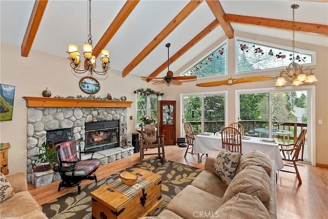 26349 Walnut Hills Dr, Lake Arrowhead, CA 92391 - living area featuring a chandelier, a stone fireplace, beam ceiling, light wood finished floors, and high vaulted ceiling