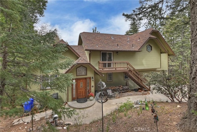 26349 Walnut Hills Dr, Lake Arrowhead, CA 92391 - rear view of house with stairs, roof with shingles, and a deck
