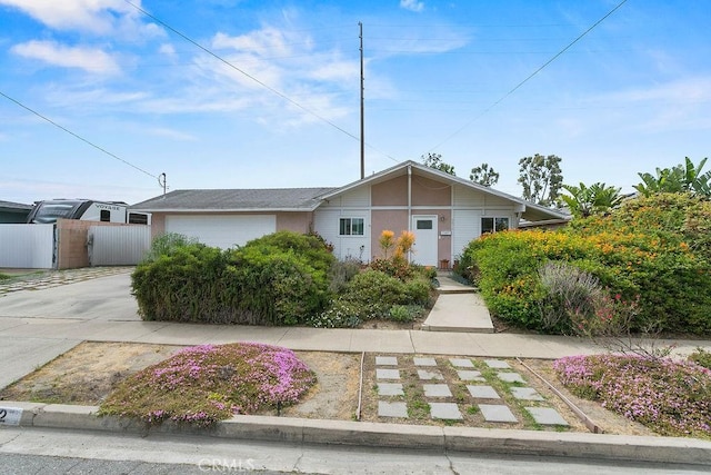 6072 Navajo Rd, Westminster, CA 92683 - view of front facade featuring a garage and driveway