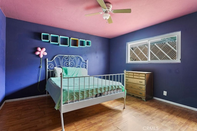 6072 Navajo Rd, Westminster, CA 92683 - bedroom with wood finished floors, baseboards, and ceiling fan