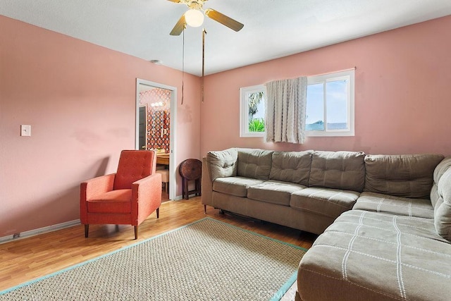 6072 Navajo Rd, Westminster, CA 92683 - living area featuring wood finished floors, a ceiling fan, and baseboards
