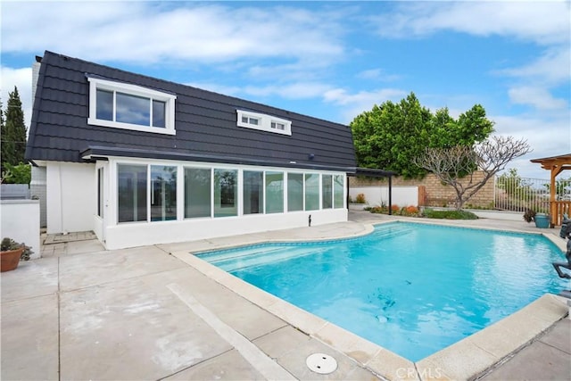 view of pool with a fenced backyard and a patio area