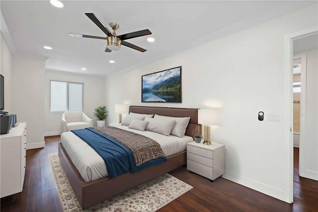 bedroom featuring baseboards, dark wood-type flooring, recessed lighting, and crown molding