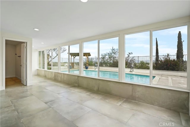 unfurnished sunroom with recessed lighting