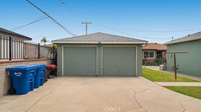 detached garage with fence