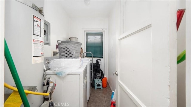 laundry area with separate washer and dryer and tile patterned flooring
