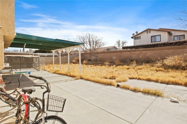 view of patio featuring fence