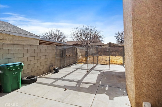 view of patio / terrace featuring fence