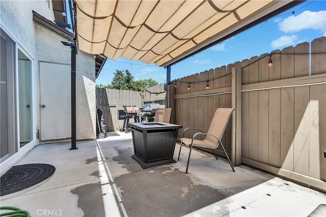view of patio / terrace featuring fence