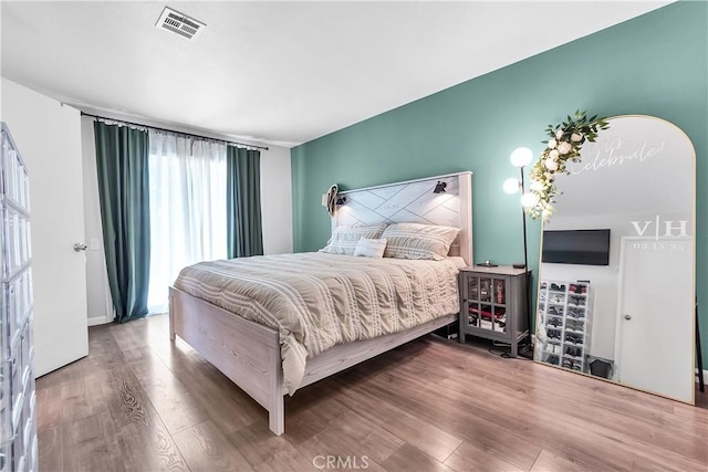 bedroom with wood finished floors