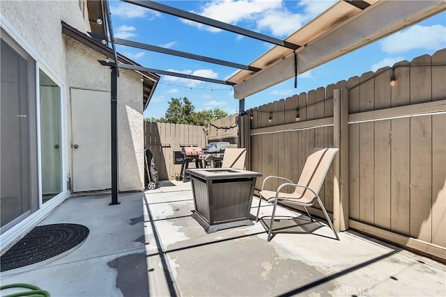 view of patio featuring fence