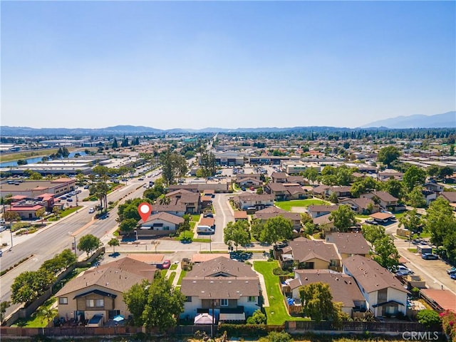 aerial view of residential area with a mountainous background
