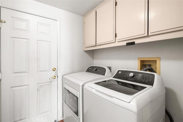 39680 Glenwood Ct, Murrieta, CA 92563 - clothes washing area with independent washer and dryer and cabinet space
