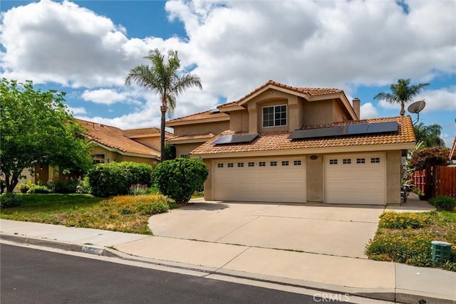 39680 Glenwood Ct, Murrieta, CA 92563 - mediterranean / spanish-style house with a chimney, driveway, stucco siding, solar panels, and a tile roof