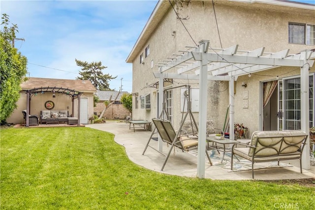 17027 Simonds St, Granada Hills, CA 91344 - rear view of house with a pergola, a patio area, stucco siding, and an outdoor living space