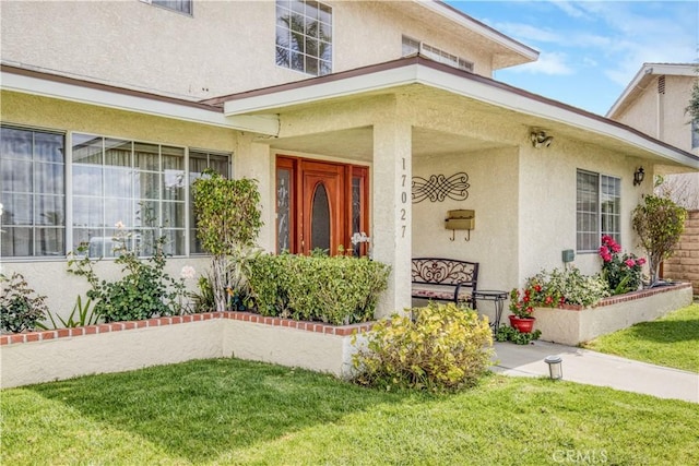 17027 Simonds St, Granada Hills, CA 91344 - entrance to property featuring stucco siding and a yard