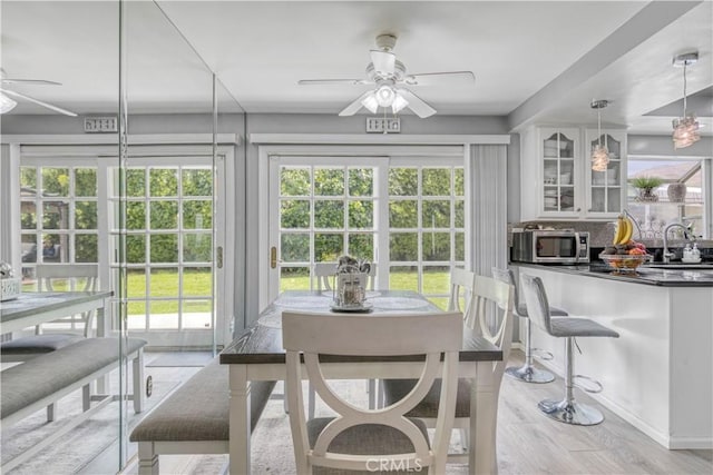 17027 Simonds St, Granada Hills, CA 91344 - dining room with a ceiling fan, healthy amount of natural light, and light wood-style flooring