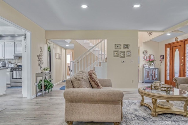 17027 Simonds St, Granada Hills, CA 91344 - living area featuring stairway, recessed lighting, baseboards, and light wood finished floors