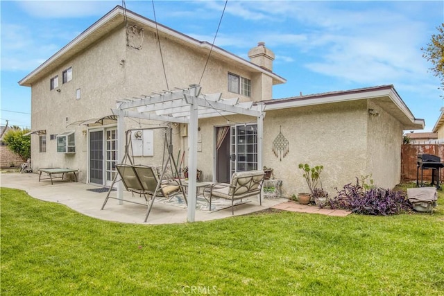 17027 Simonds St, Granada Hills, CA 91344 - rear view of house with a pergola, stucco siding, a chimney, and a patio area