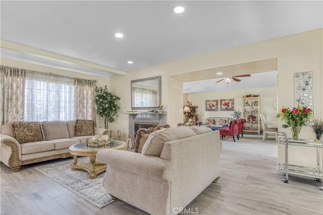17027 Simonds St, Granada Hills, CA 91344 - living area featuring light wood-style floors, ceiling fan, a premium fireplace, and recessed lighting