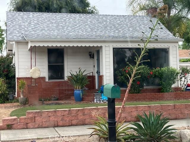 2051 6th St, La Verne, CA 91750 - view of front of property featuring a shingled roof, a chimney, and brick siding