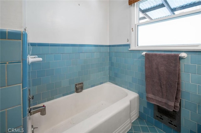 1315 S Walker Ave, San Pedro, CA 90731 - bathroom featuring tile walls, a bathtub, wainscoting, and tile patterned floors