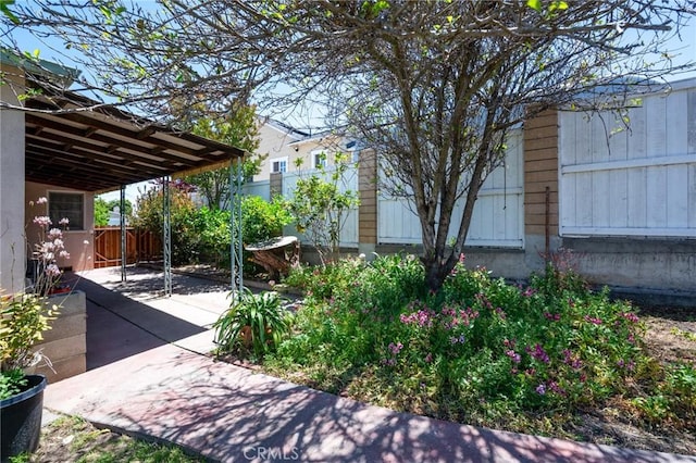 1315 S Walker Ave, San Pedro, CA 90731 - view of yard featuring fence, a patio area, and a carport