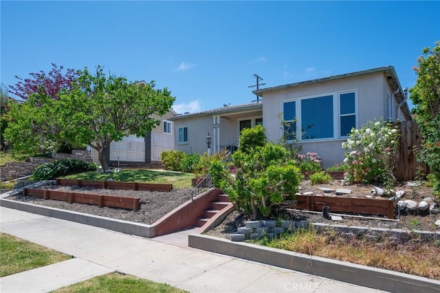 1315 S Walker Ave, San Pedro, CA 90731 - view of front facade with a vegetable garden and stucco siding
