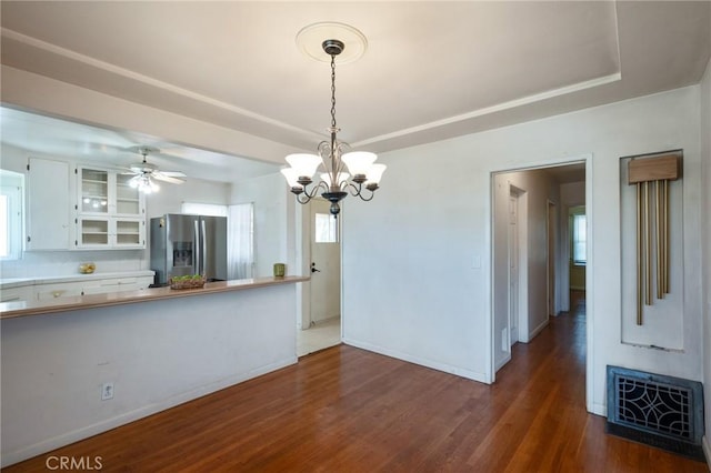 1315 S Walker Ave, San Pedro, CA 90731 - unfurnished dining area with a chandelier, dark wood-style floors, baseboards, and a raised ceiling