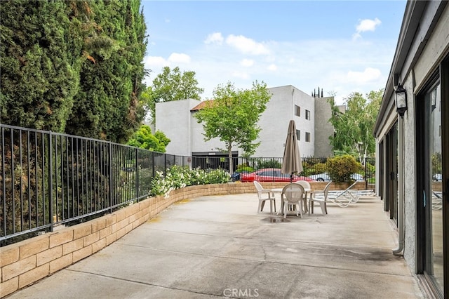 254 E Fern Ave Unit 108, Redlands, CA 92373 - view of patio / terrace featuring outdoor dining space and fence