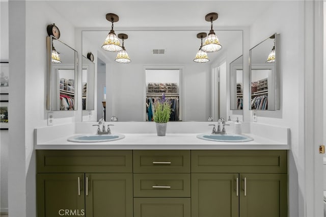 254 E Fern Ave Unit 108, Redlands, CA 92373 - bathroom featuring double vanity and a spacious closet