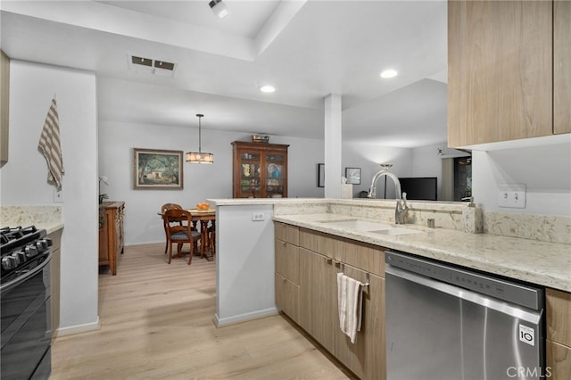 254 E Fern Ave Unit 108, Redlands, CA 92373 - kitchen featuring stainless steel dishwasher, a sink, black gas stove, baseboards, and light wood finished floors