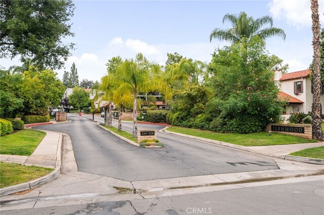 254 E Fern Ave Unit 108, Redlands, CA 92373 - view of asphalt road with curbs, sidewalks, and a gated entry