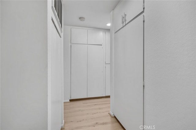 254 E Fern Ave Unit 108, Redlands, CA 92373 - corridor featuring light wood-style flooring