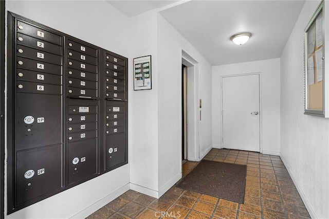 254 E Fern Ave Unit 108, Redlands, CA 92373 - corridor featuring baseboards and mail area