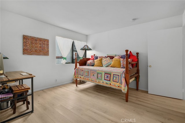 254 E Fern Ave Unit 108, Redlands, CA 92373 - bedroom featuring light wood finished floors and baseboards