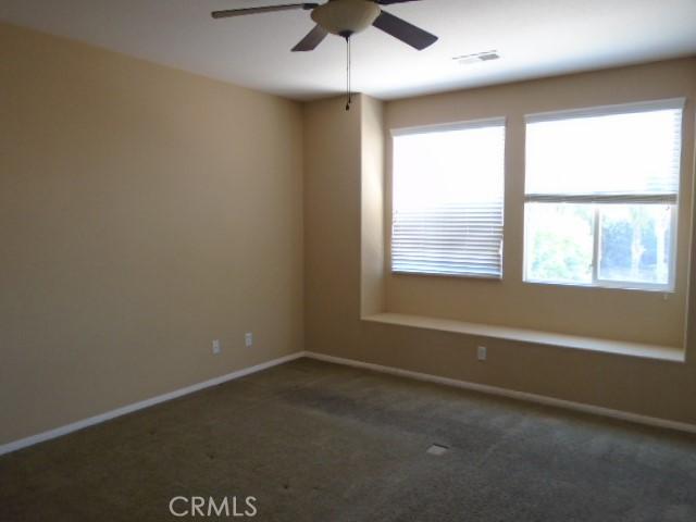 29221 Loden Cir, Menifee, CA 92584 - carpeted empty room featuring a ceiling fan and baseboards