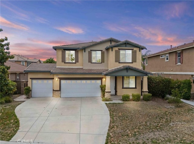 29221 Loden Cir, Menifee, CA 92584 - view of front of house featuring concrete driveway, a tiled roof, stucco siding, and a garage