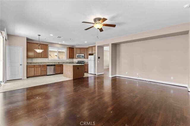 29221 Loden Cir, Menifee, CA 92584 - unfurnished living room with ceiling fan, light wood-type flooring, baseboards, and recessed lighting