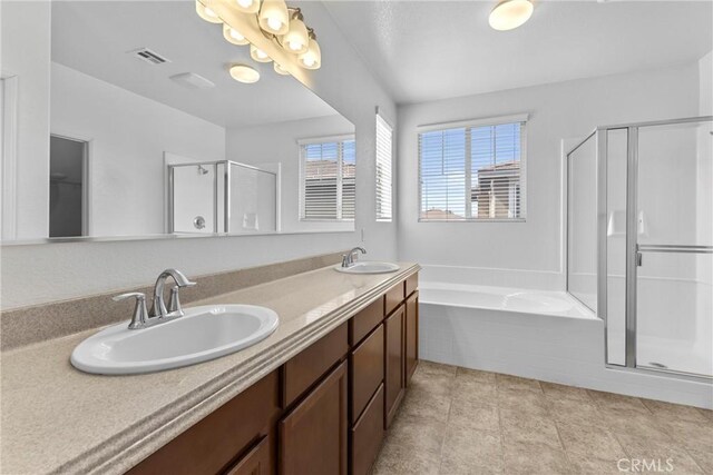 29221 Loden Cir, Menifee, CA 92584 - bathroom featuring a stall shower, a bath, double vanity, and tile patterned flooring