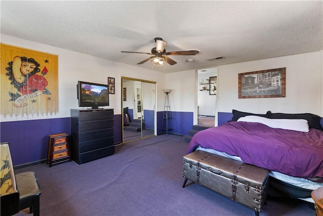 7045 Varna Ave, North Hollywood, CA 91605 - bedroom featuring carpet floors, a closet, a textured ceiling, a ceiling fan, and baseboards