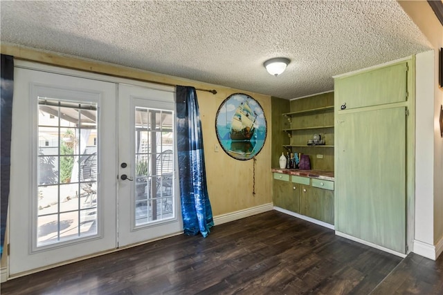 7045 Varna Ave, North Hollywood, CA 91605 - doorway featuring french doors, dark wood finished floors, a textured ceiling, and baseboards