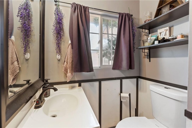 7045 Varna Ave, North Hollywood, CA 91605 - half bathroom featuring toilet and vanity